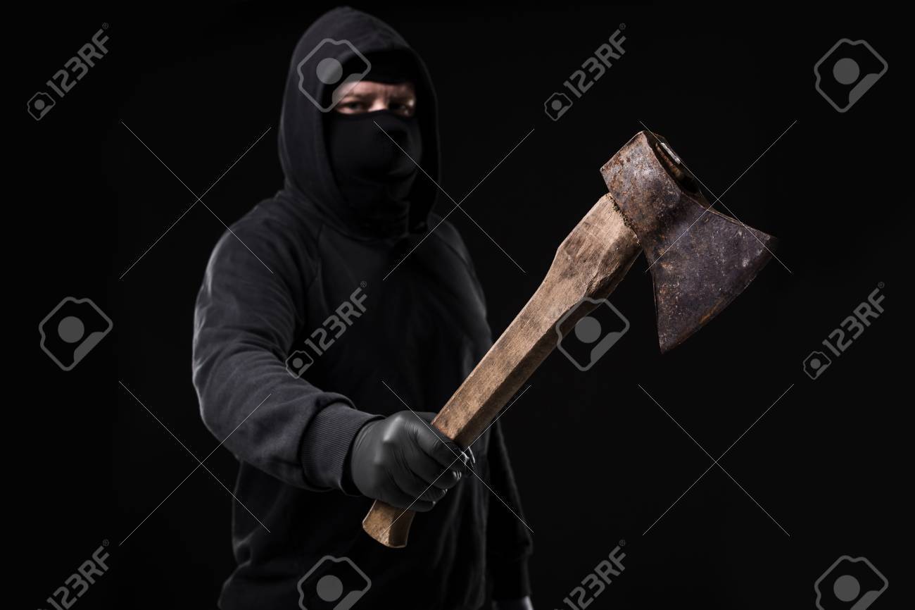 Bandit In Black Mask With Hatchet On Background Masked
