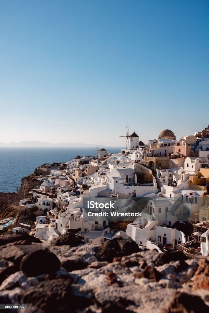 Free download Vertical Shot Of White Buildings At Shore In Santorini