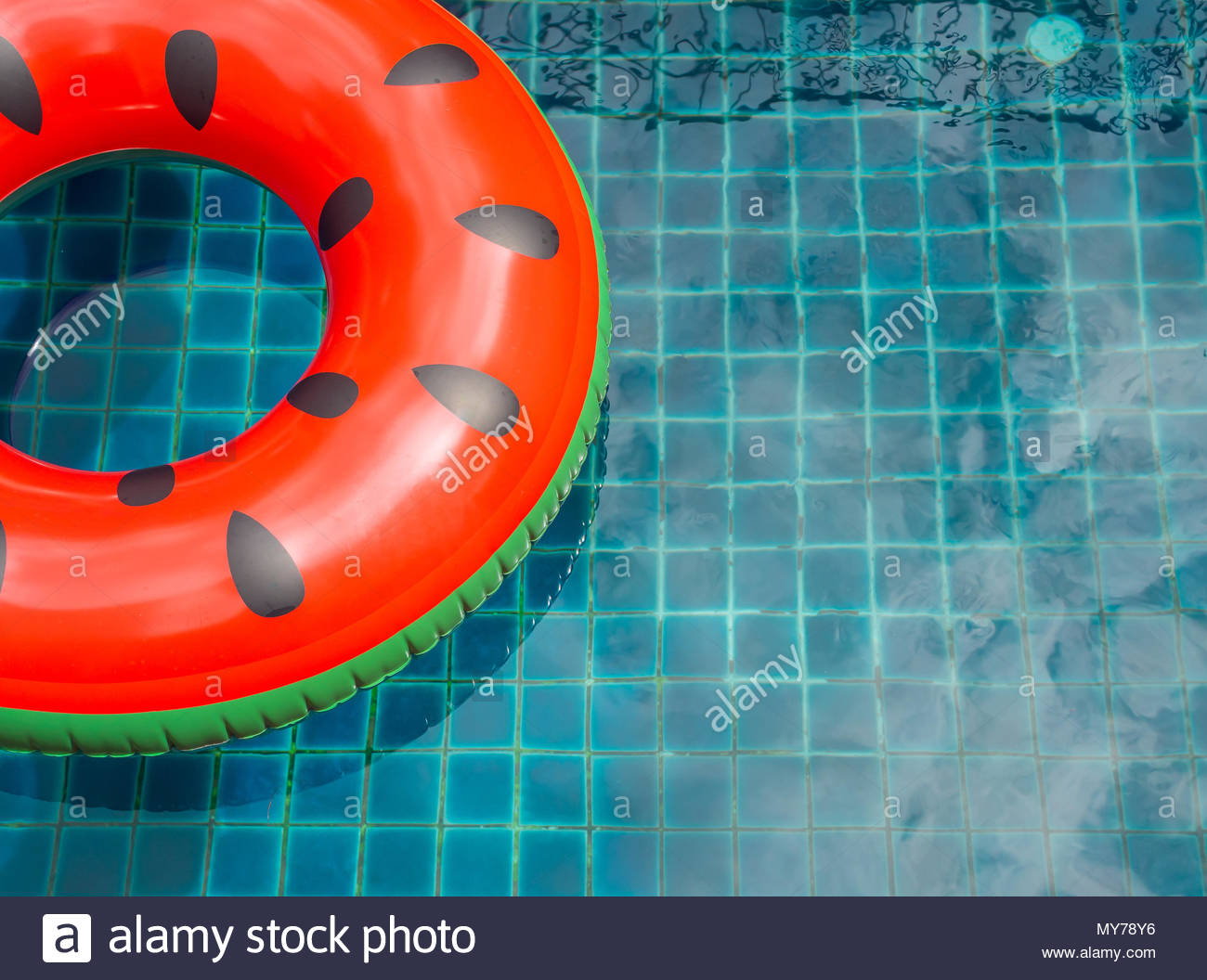 Free download Pool Float Ring are Floating on Swimming Pool Background