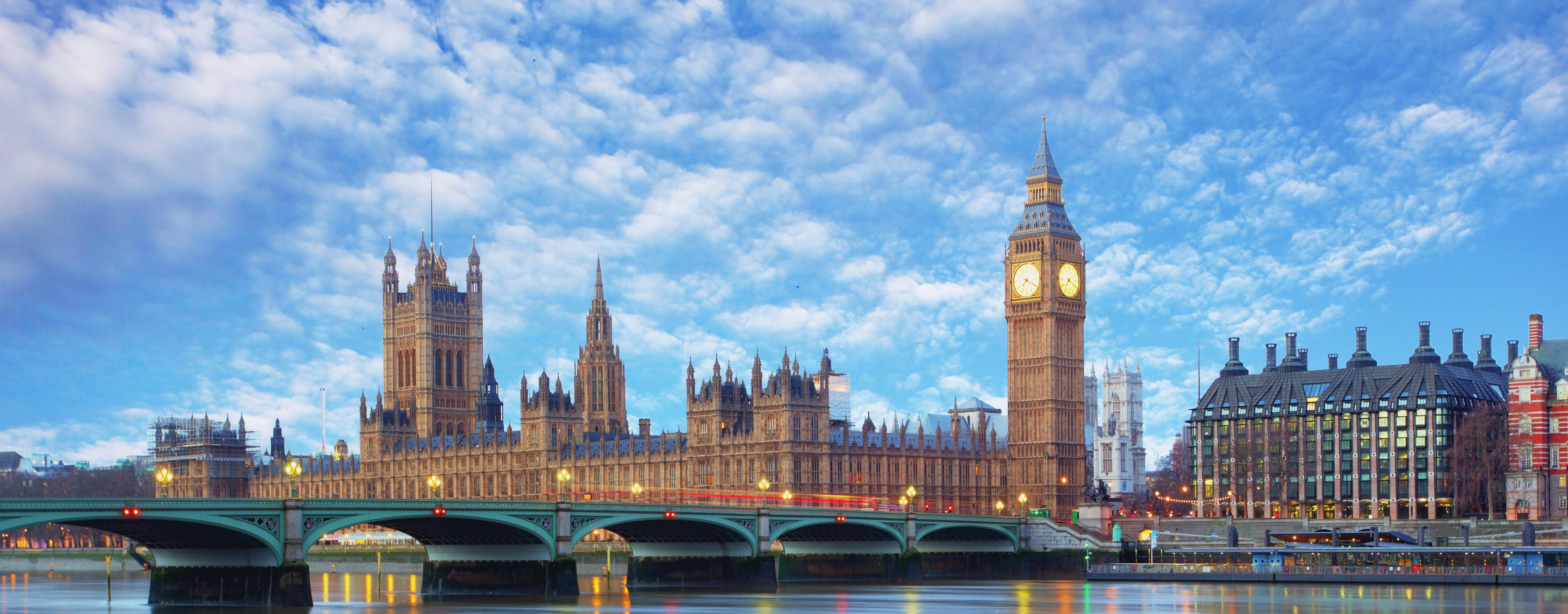 A breathtaking panoramic view of the Houses of Parliament and Big Ben in London, England, at sunset