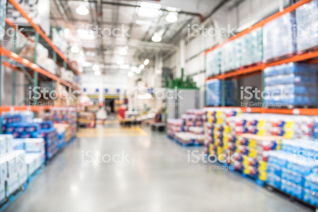 Blurry Background Worker Stack Goods On Forklifts At Wholesale