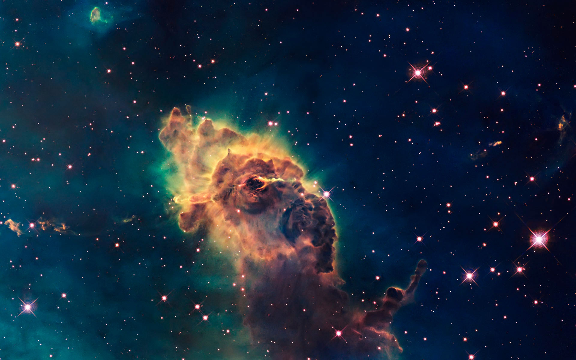 A breathtaking view of a nebula, a cosmic cloud of gas and dust, set against a backdrop of a vast starfield. This stunning image showcases vibrant colors and intricate details of the nebula, making it an ideal desktop wallpaper for space enthusiasts