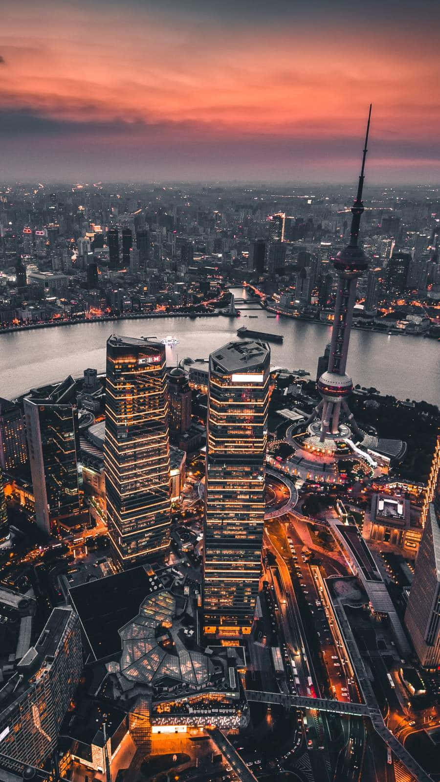 Enjoy A City Skyline Sunset From The Comfort Of Your iPhone Wallpaper