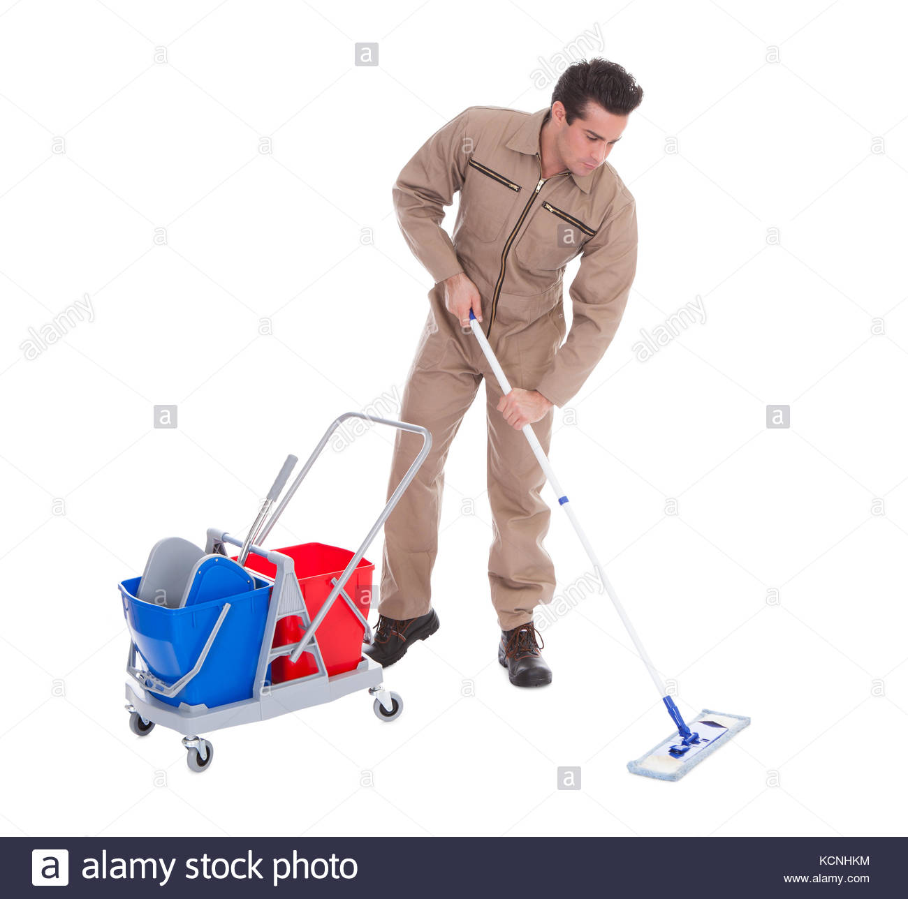 Young Male Sweeper Cleaning Floor On White Background Stock Photo