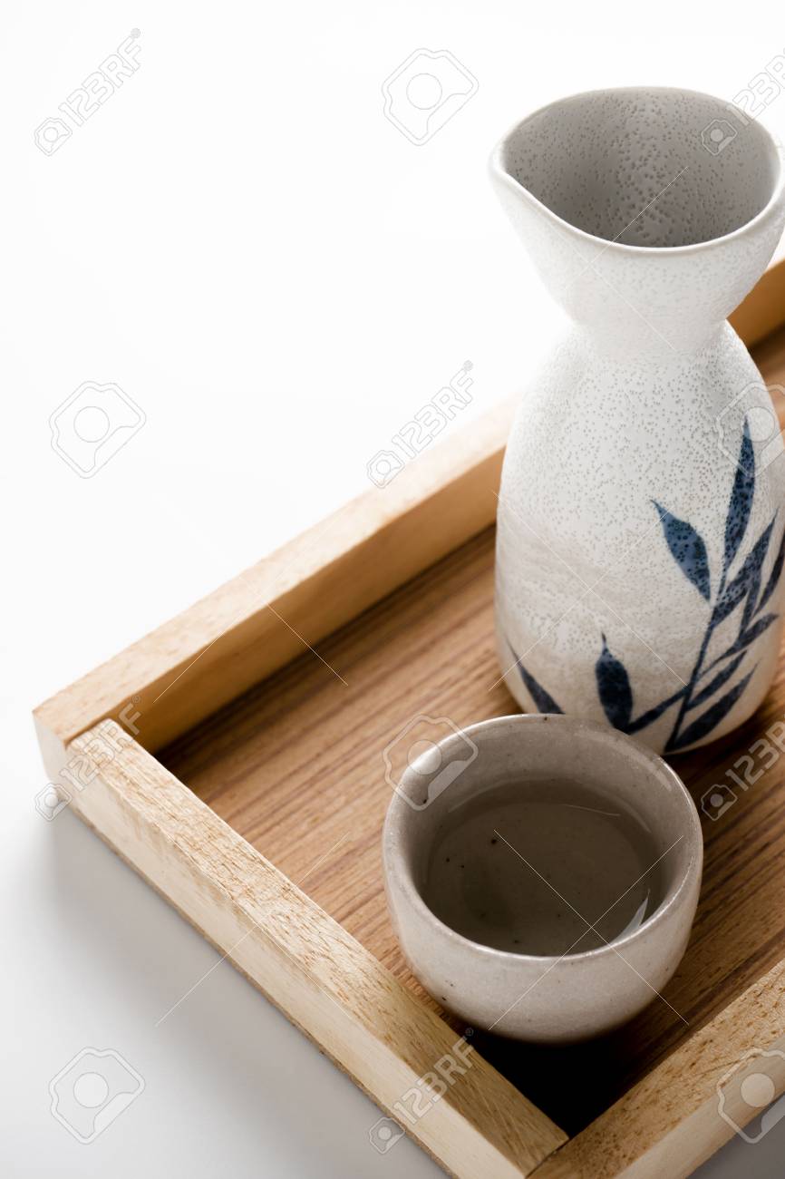 Close Up Of Japanese Sake Drinking Set On Table Background Stock
