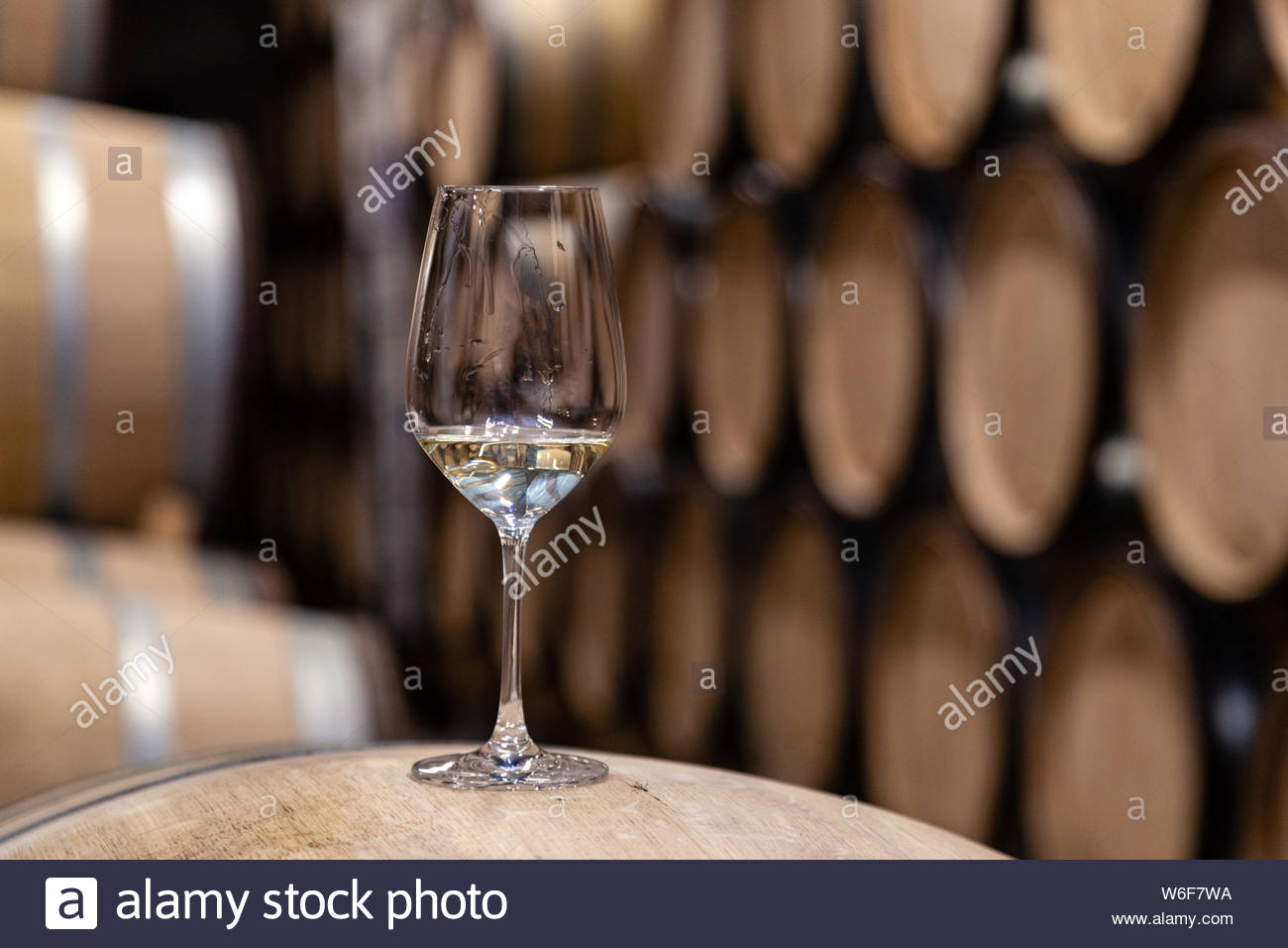 Closeup Glass With White Wine On Background Wooden Oak