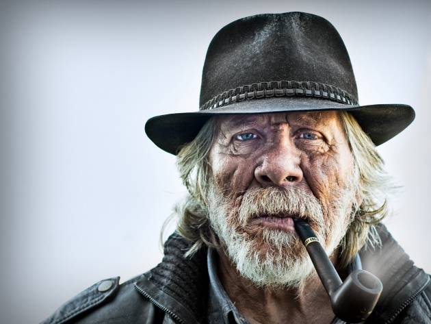 Old Man Smoking A Pipe