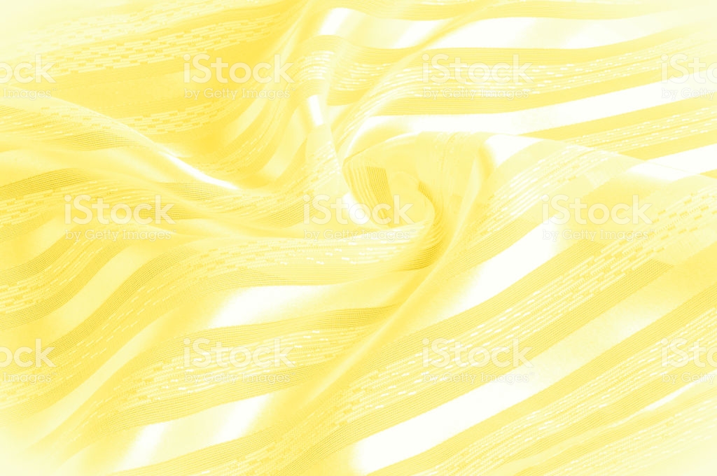 Background Texture Pattern Yellow Silk Fabric With A Light Stripe