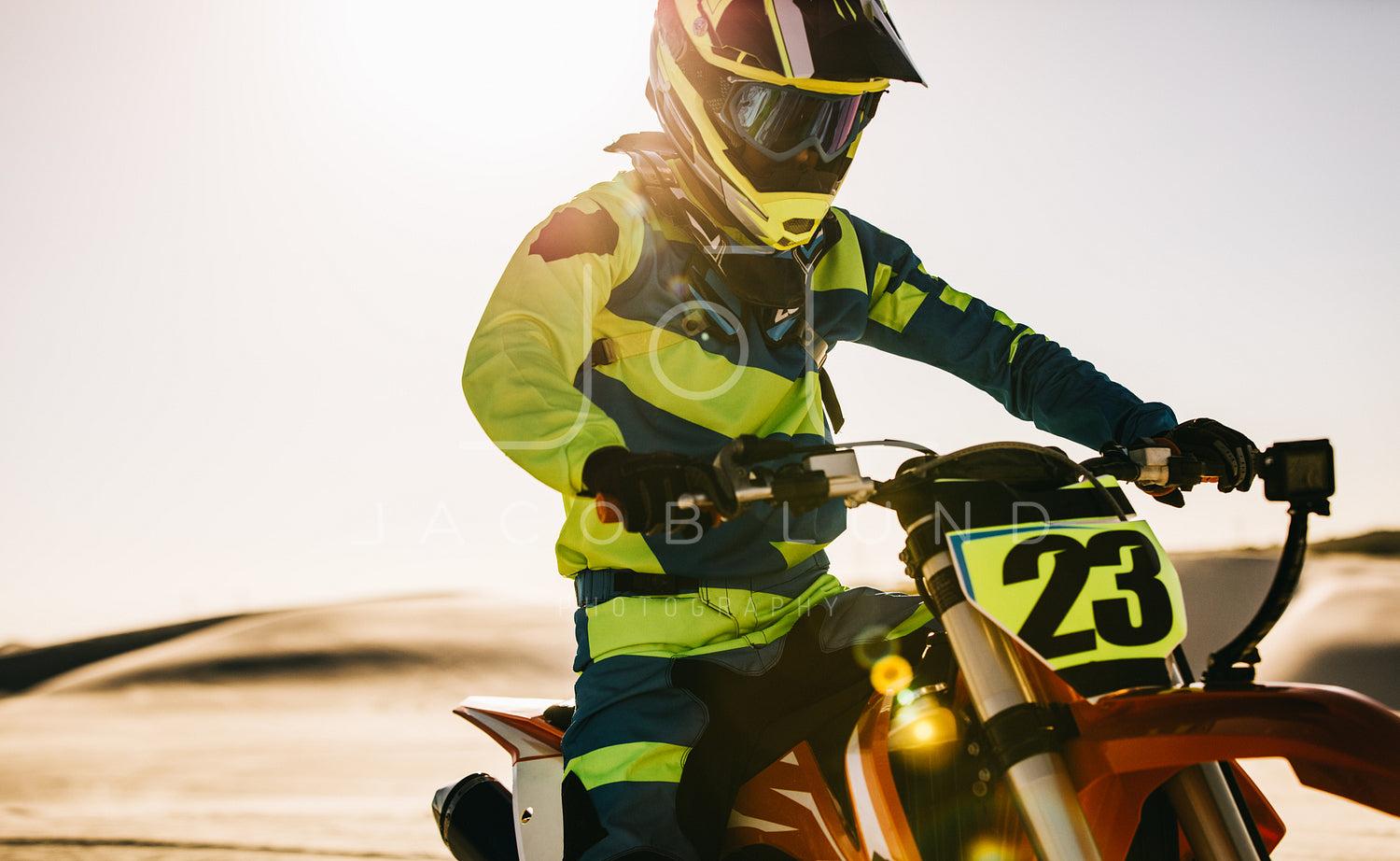 Motocross Biker In Racing Gear On His Bike During A Race Jacob