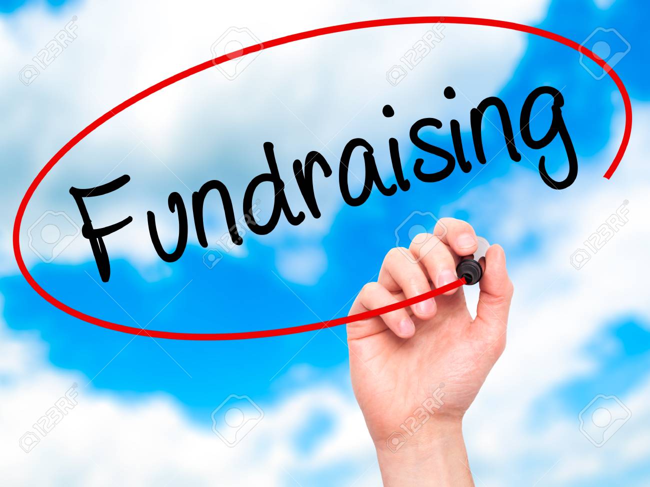 Man Hand Writing Fundraising With Black Marker On Visual Screen