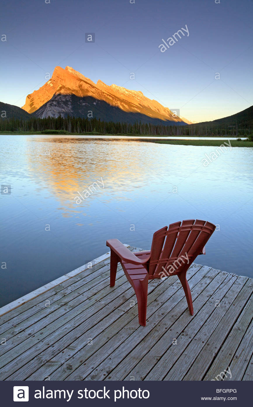 Chair On Jetty At Vermillion Lake With Mount Rundle In Background