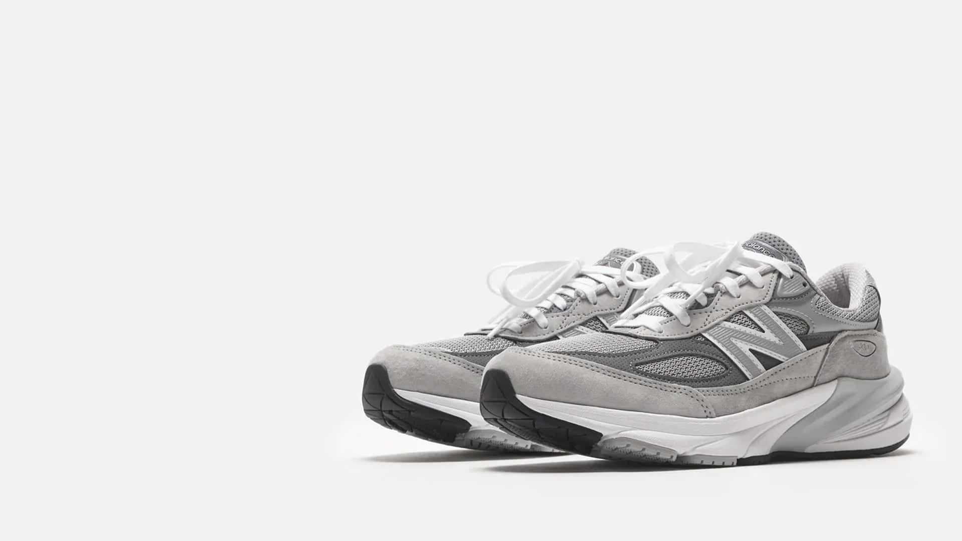 Feel The Stability Of New Balance Family Shoes Wallpaper