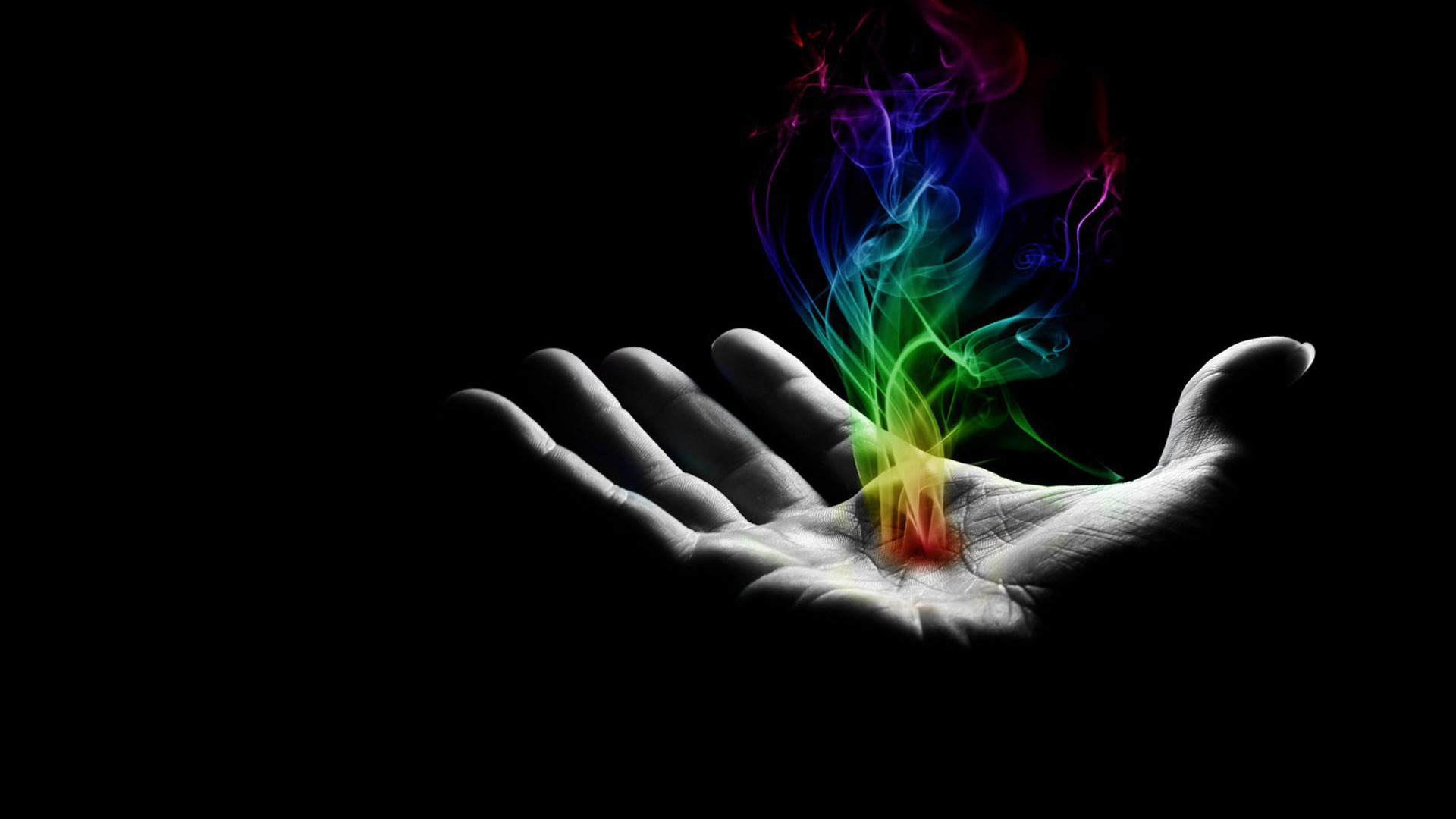 Download Colorful smoke in hand wallpaper