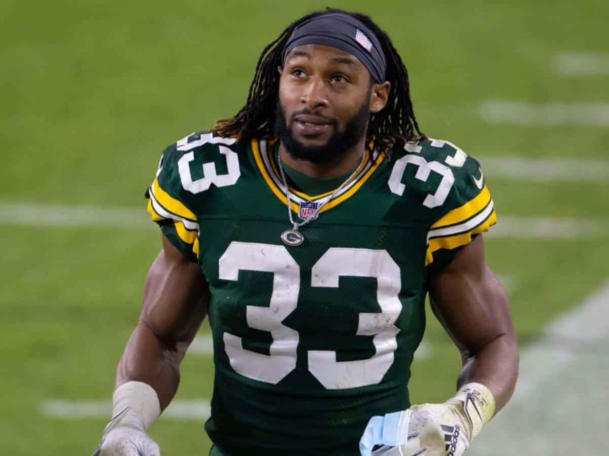 Aaron Jones Of The Green Bay Packers On Move Wallpaper