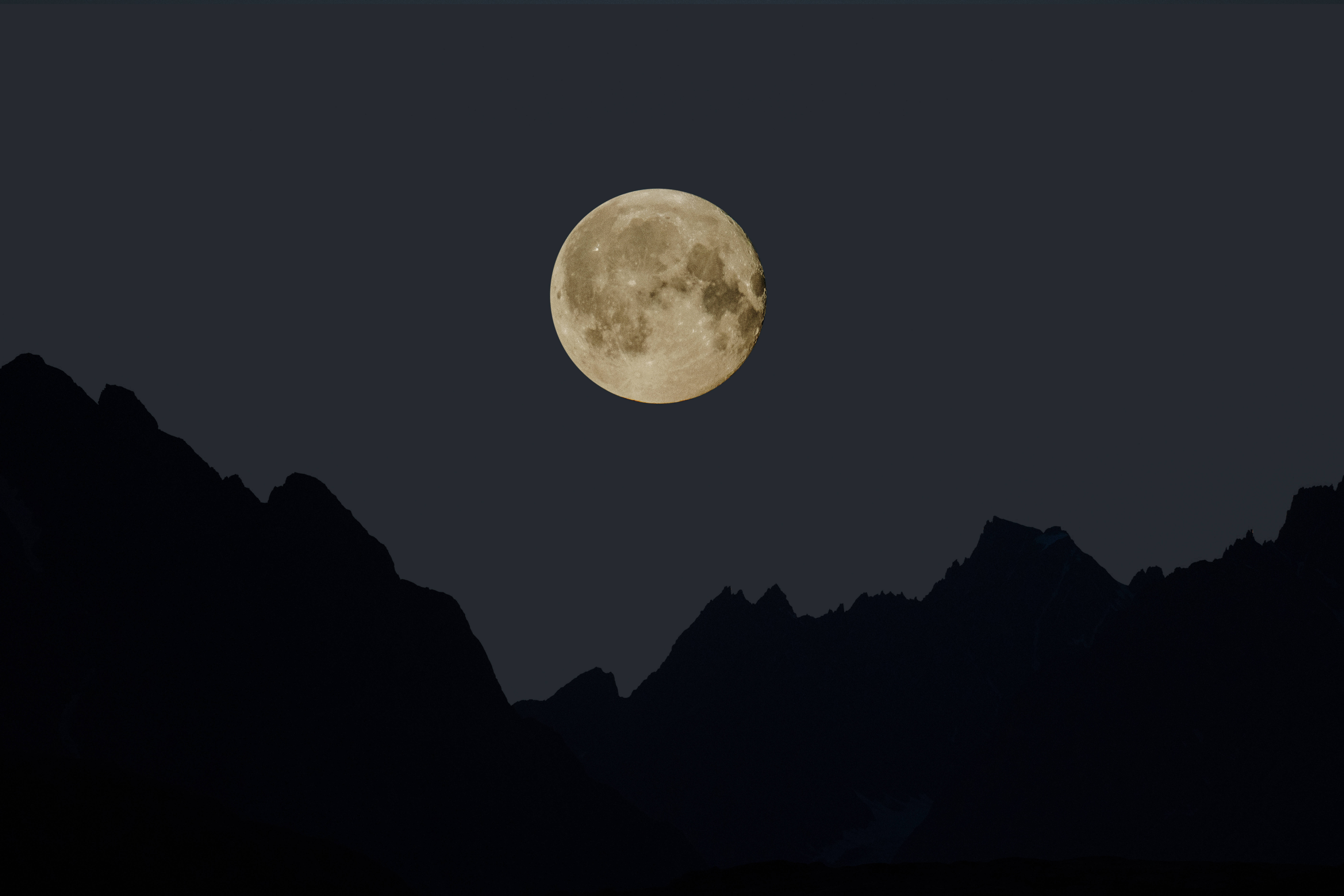 Aesthetic Silhouette Of A Full Moon On Crisp Night Sky Wallpaper