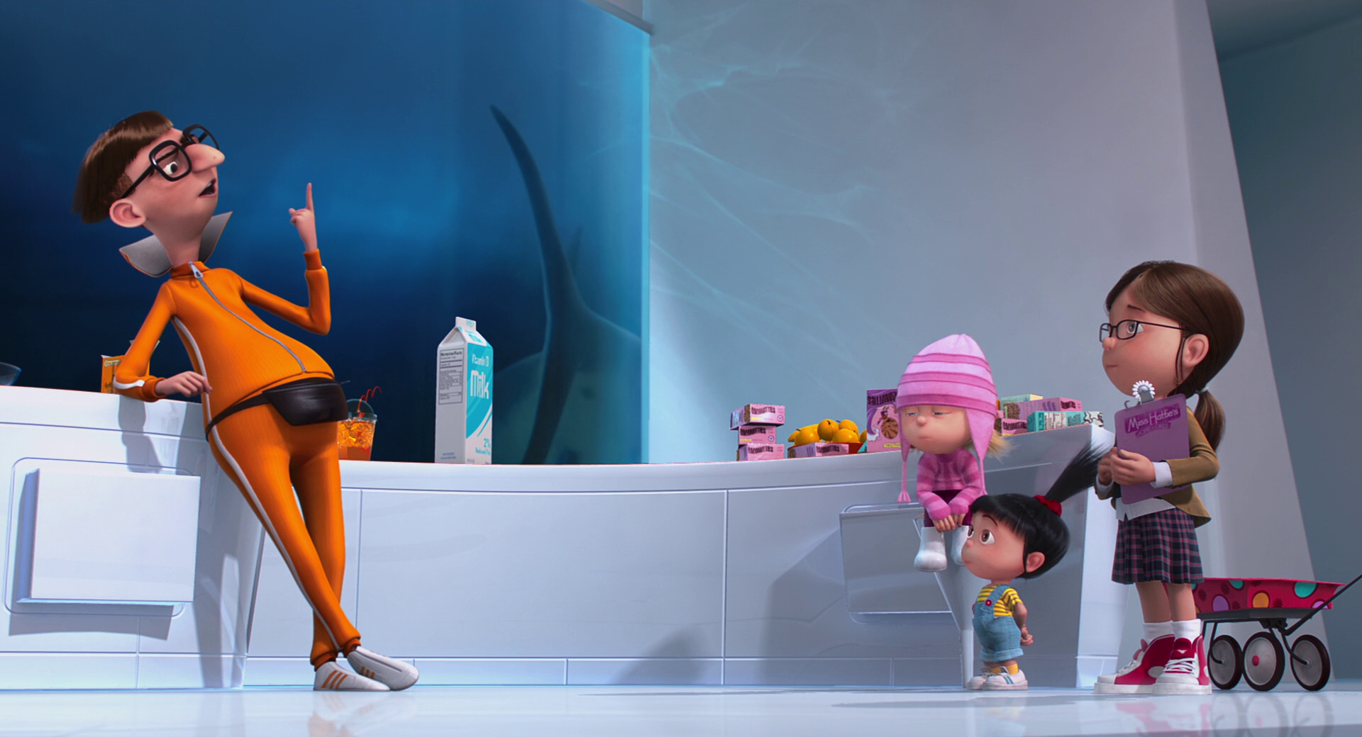 Vector, the villain from Despicable Me, stands in his futuristic kitchen, giving instructions to Margo, Edith, and Agnes