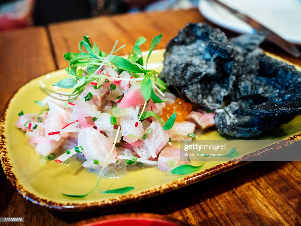 High Angle Of Ceviche Served On Wooden Table Stock Photo