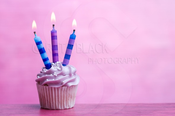 BirtHDay Cupcake On A Purple Background Royalty Stock Photo