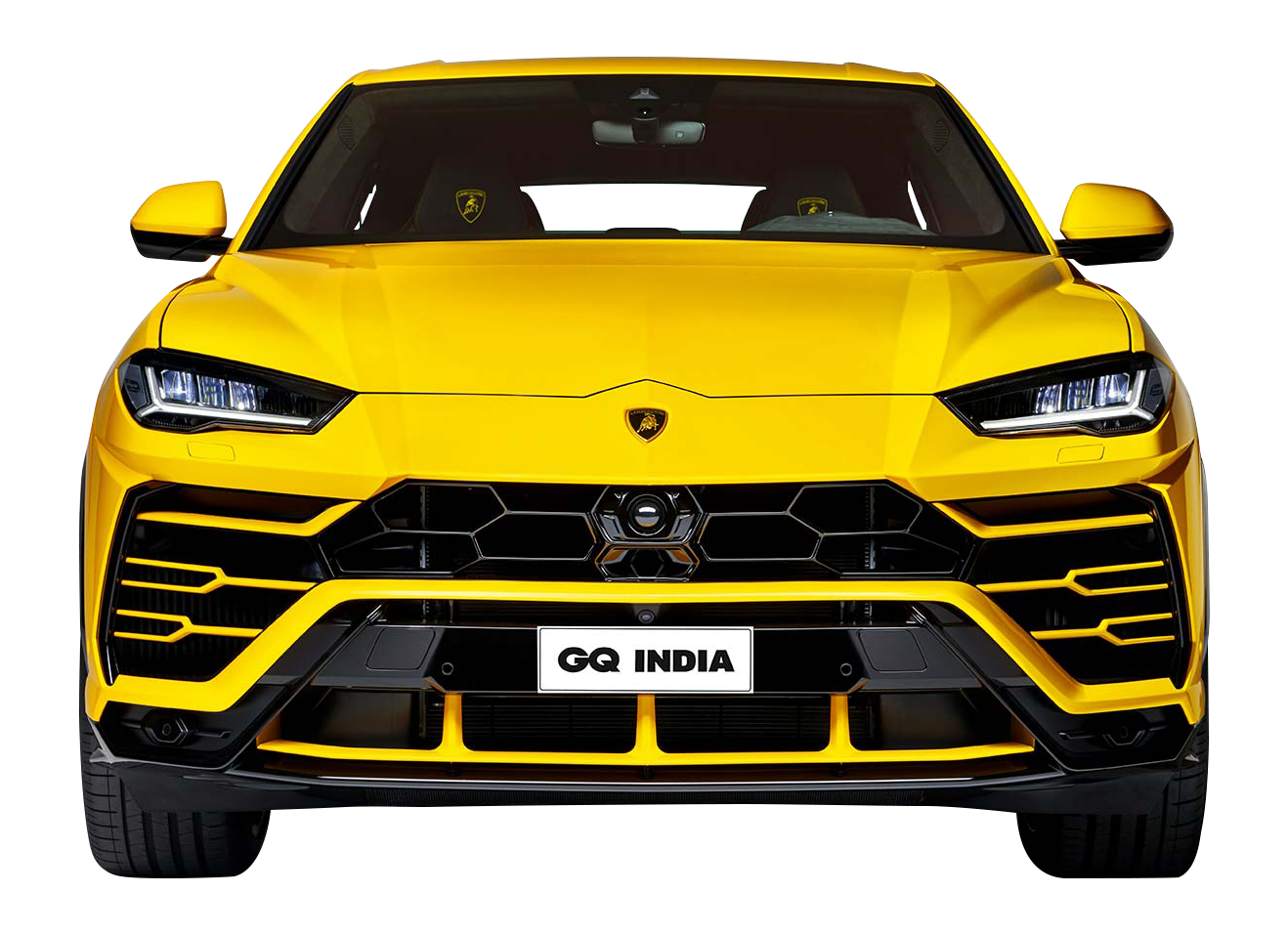 Close-up front view of a vibrant yellow Lamborghini Urus against a black background