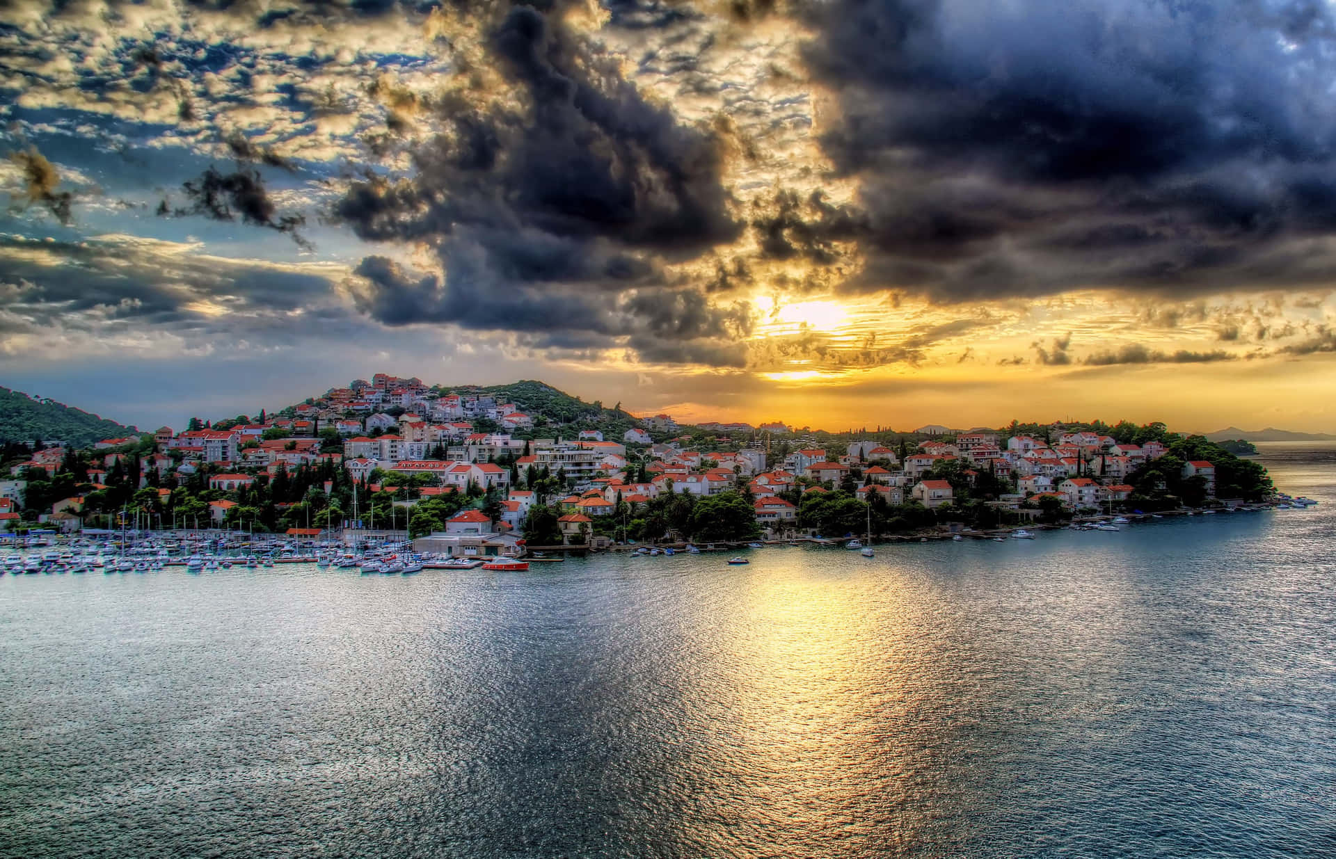 Crotia Under Fluffy Gray Clouds Wallpaper