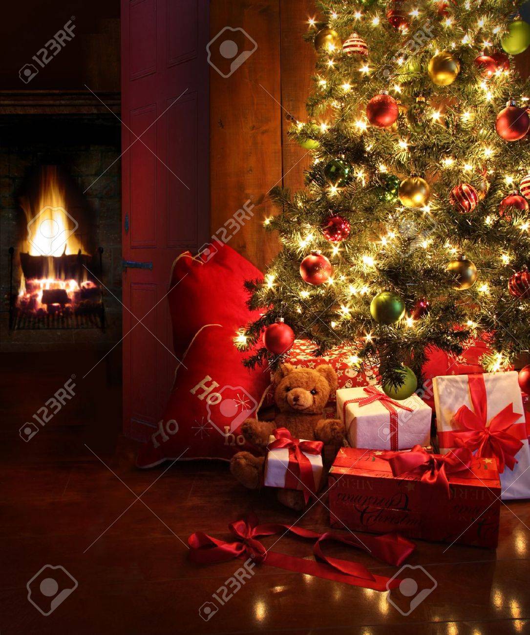 Christmas Scene With Tree Gifts And Fire In Background Stock Photo