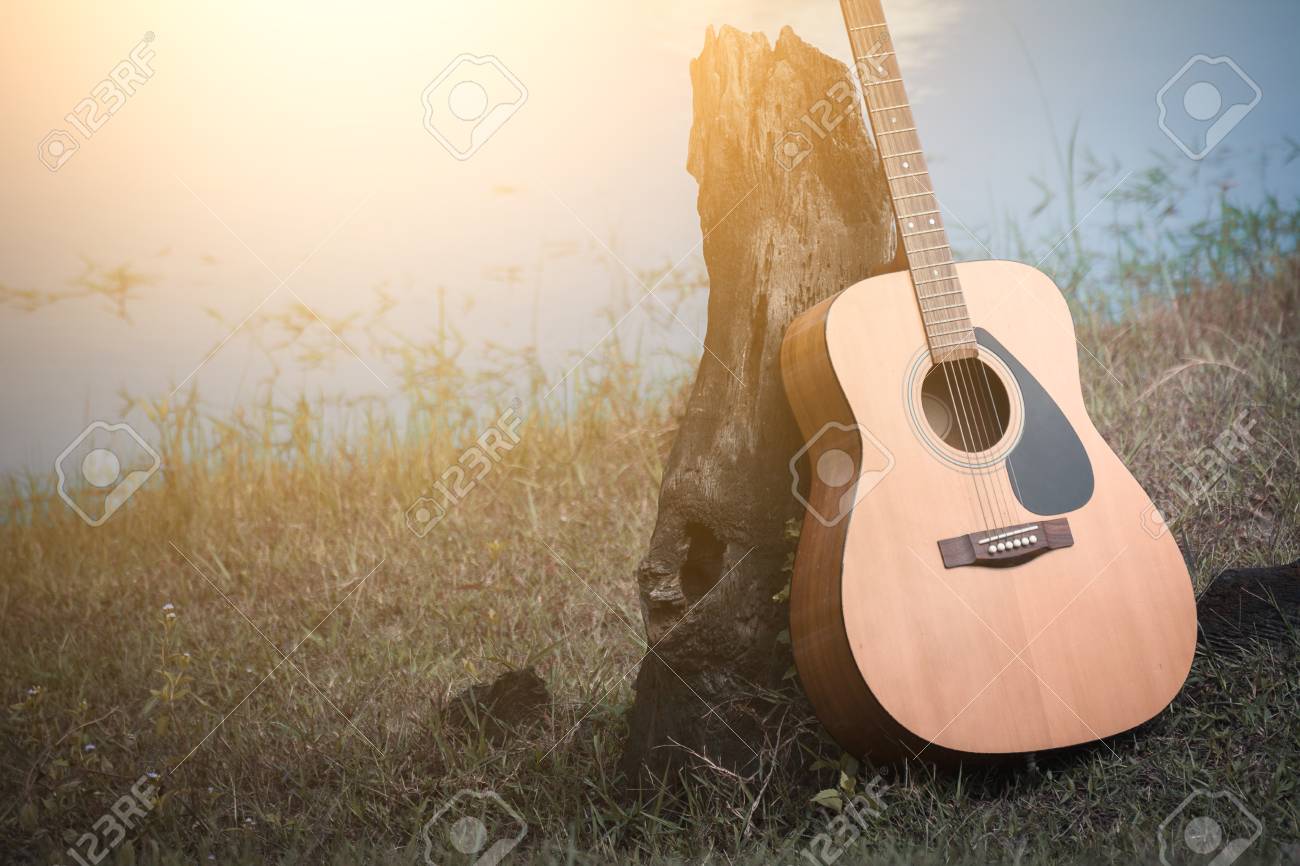 Acoustic Guitar Background On Riverside Stock Photo Picture And