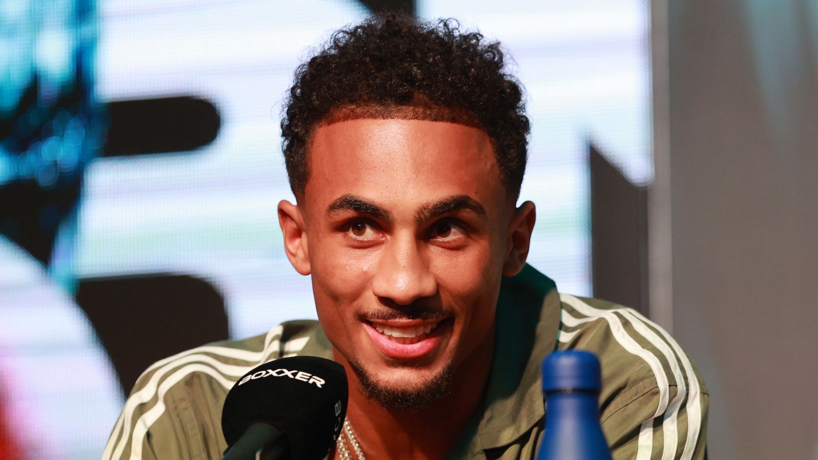 Benjamin Whittaker smiles during a press conference