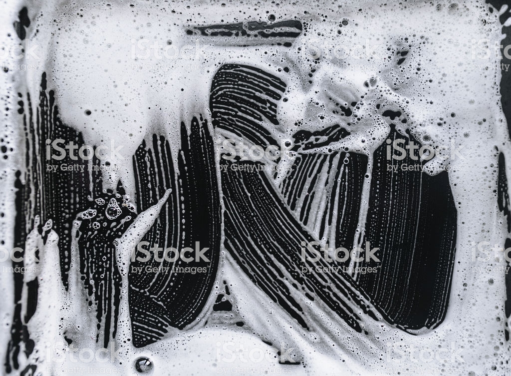 Foam And Soap On Black Background The Concept Of Washing Oily Pan