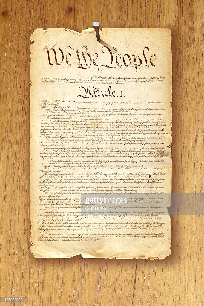 Constitution Fixed With Nail On Wooden Background Stock Photo