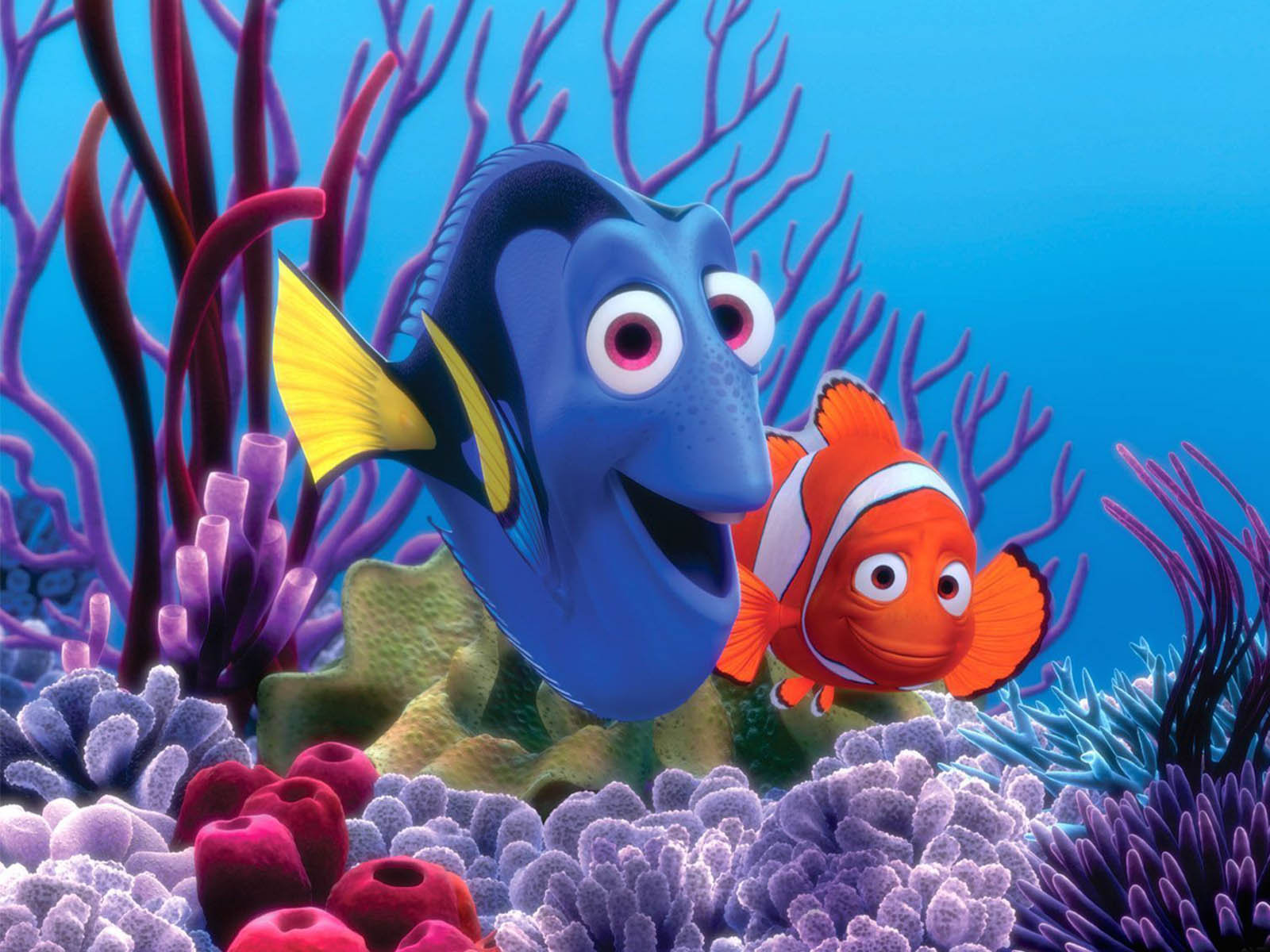 Dory and Nemo, the two main characters from Finding Nemo, swim amongst vibrant coral in the ocean