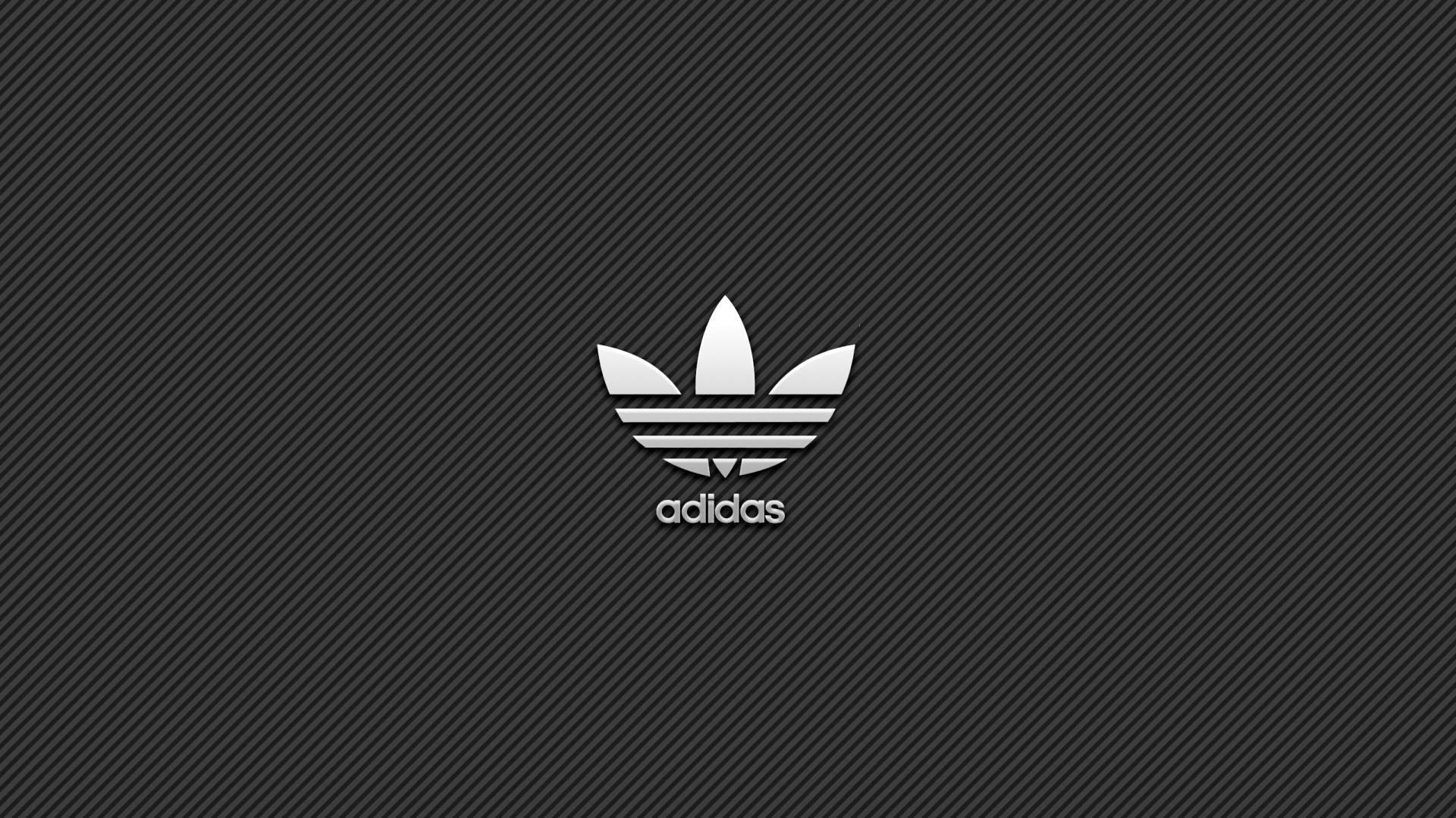 Adidas logo on a dark gray diagonal striped background