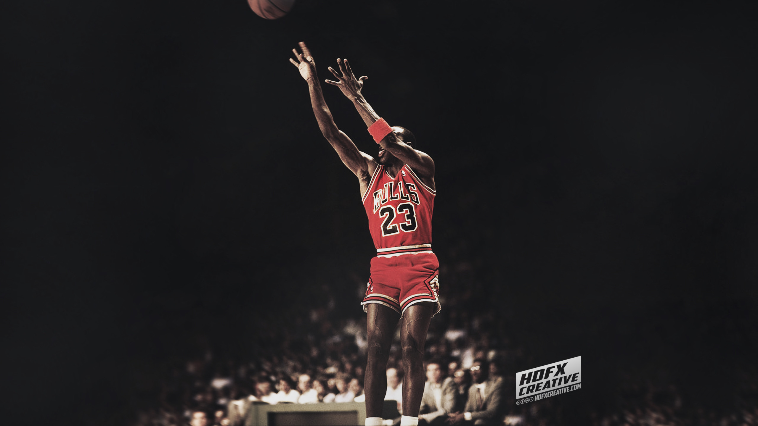 Michael Jordan performing a jump shot in a Chicago Bulls uniform
