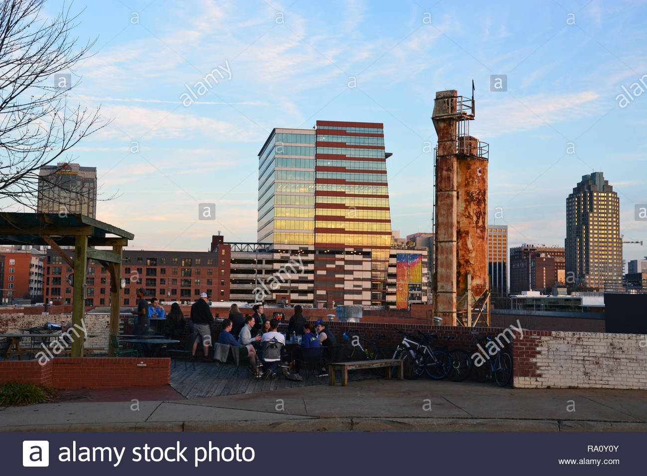 The Raleigh Nc Skyline Is In Background Of Beer Garden At