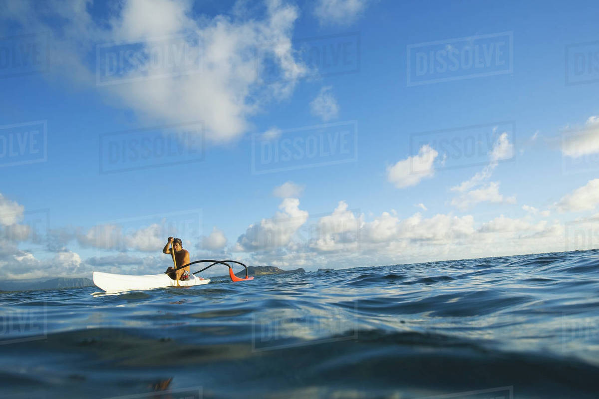 Hawaii Oahu Lanikai Man Paddling One Outrigger Canoe Land