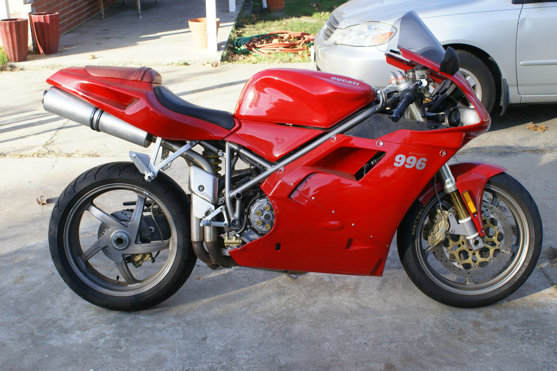 Red Ducati 996 Motorcycle Parked on Pavement