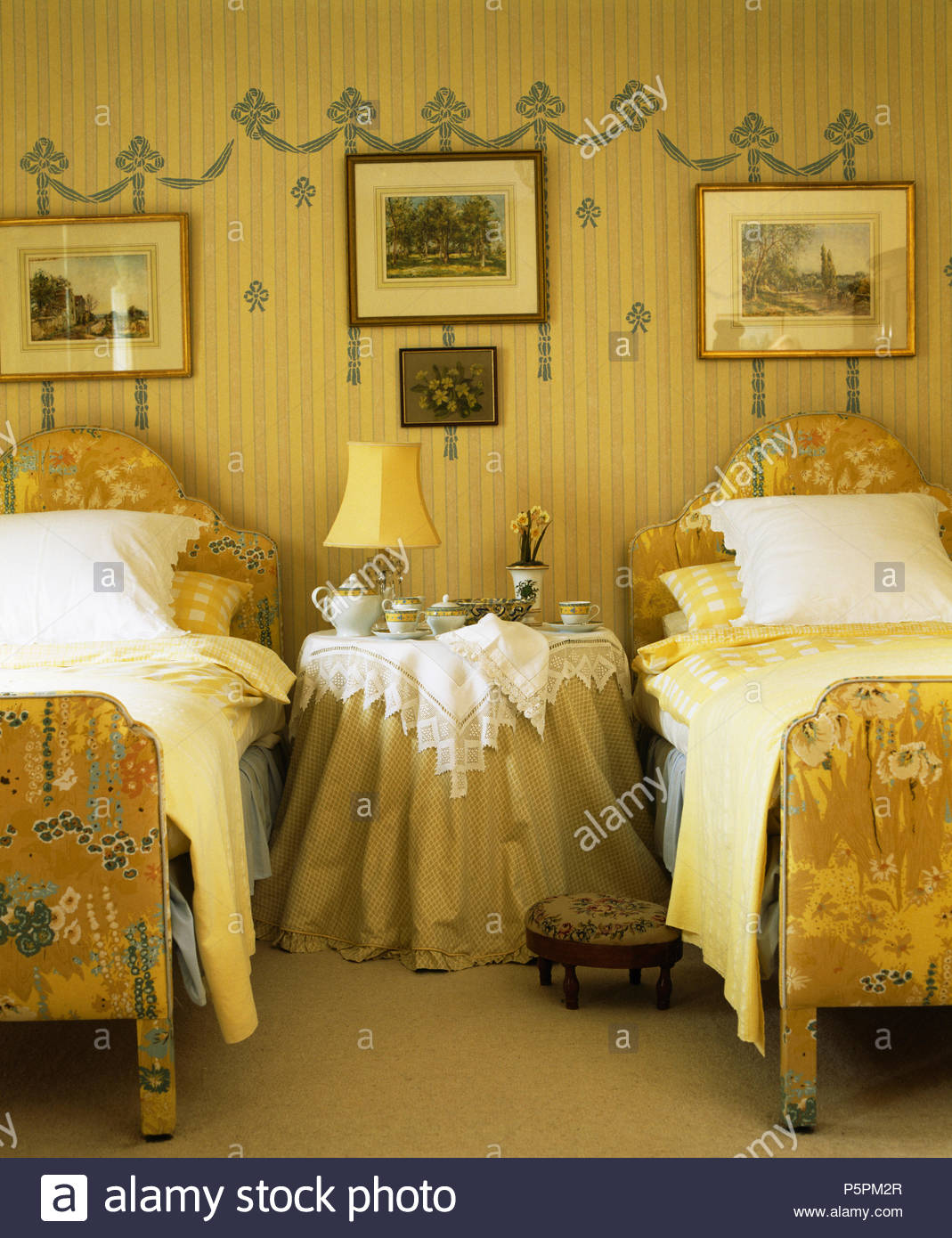 Pictures On Wall Above Upholstered Vintage Twin Beds In French
