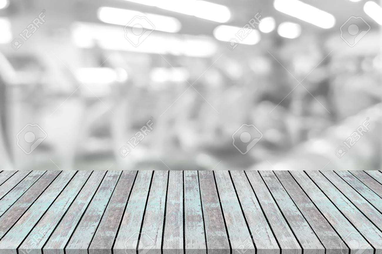 Empty Wooden Board Space Platform With Blur Fitness Gym Equipment