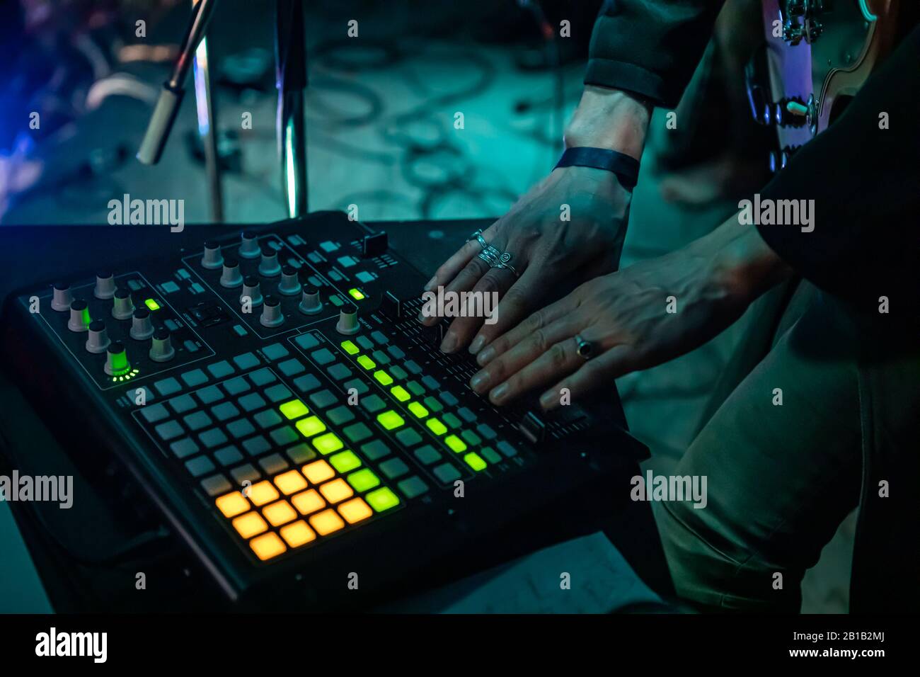 A Closeup And High Angle On The Hands Of An Electronic Music