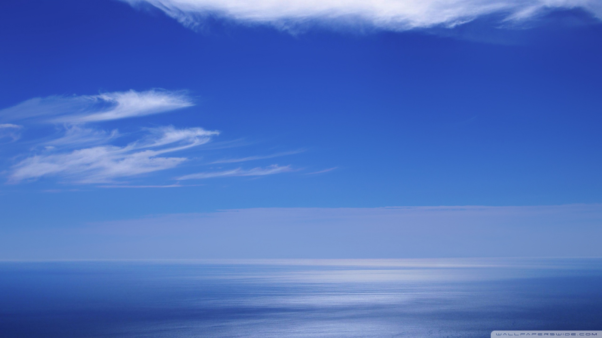 Calm Ocean And Blue Sky Wallpaper
