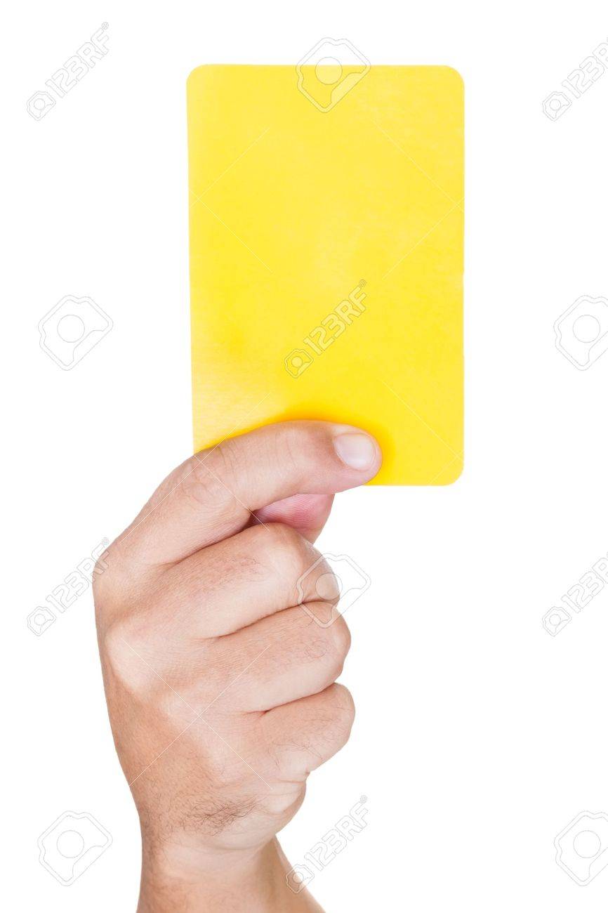 Hand Of Soccer Referee Showing Yellow Card On White Background