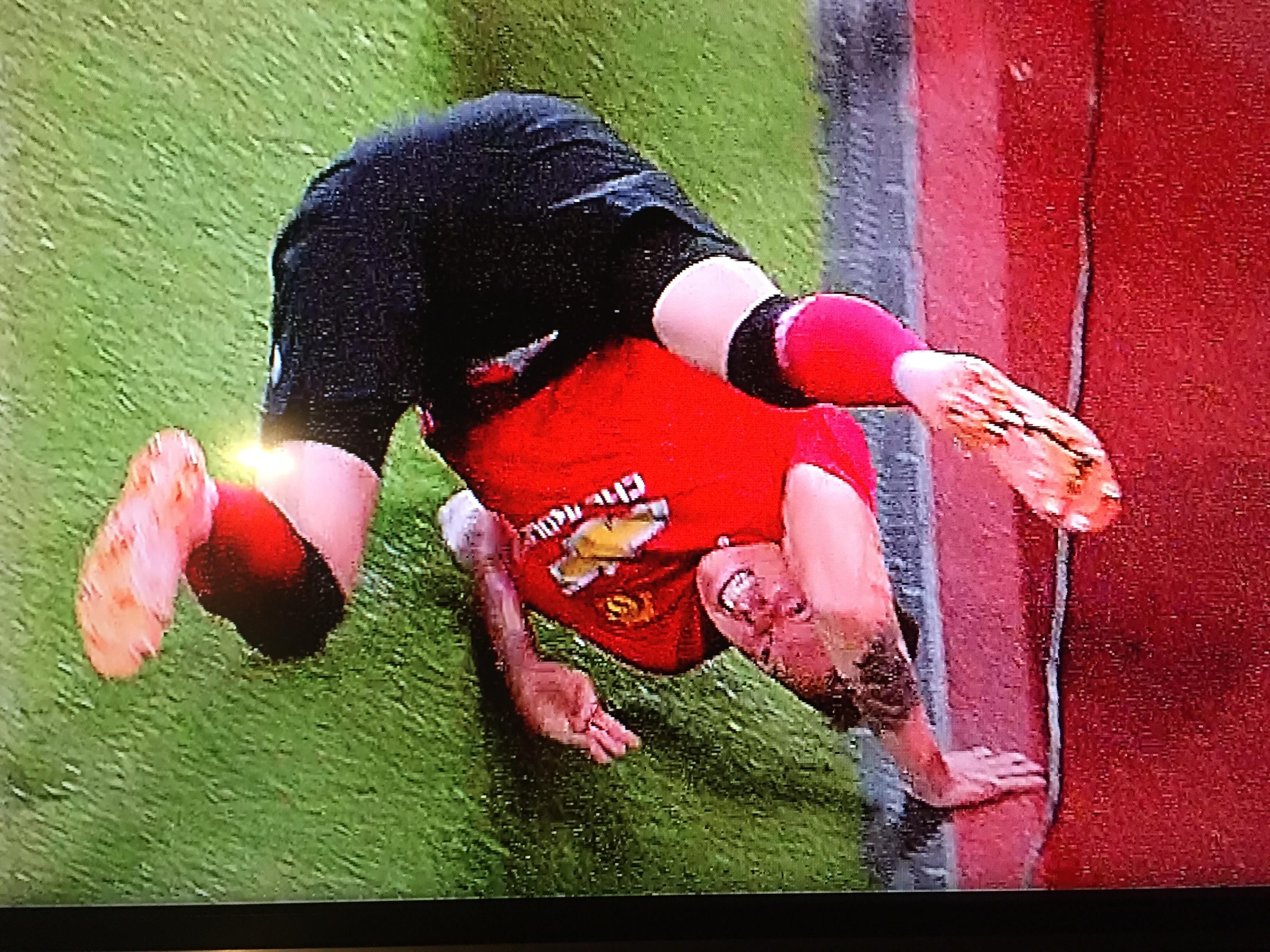 Phil Jones Crashing Out Of The Cup Wallpaper