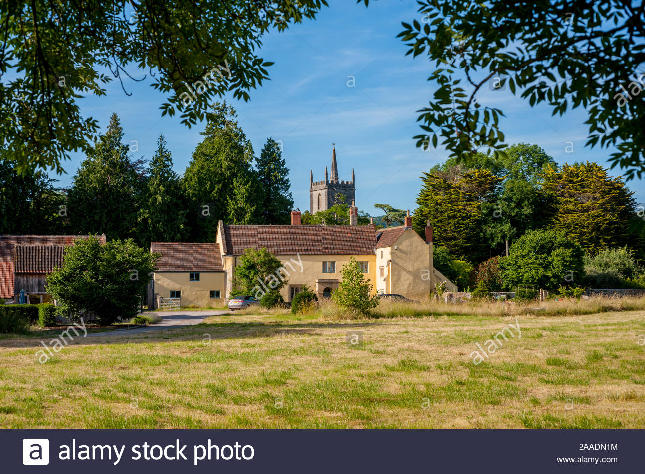 Fields And Farm At Wookey Somerset With St Mathews Church In