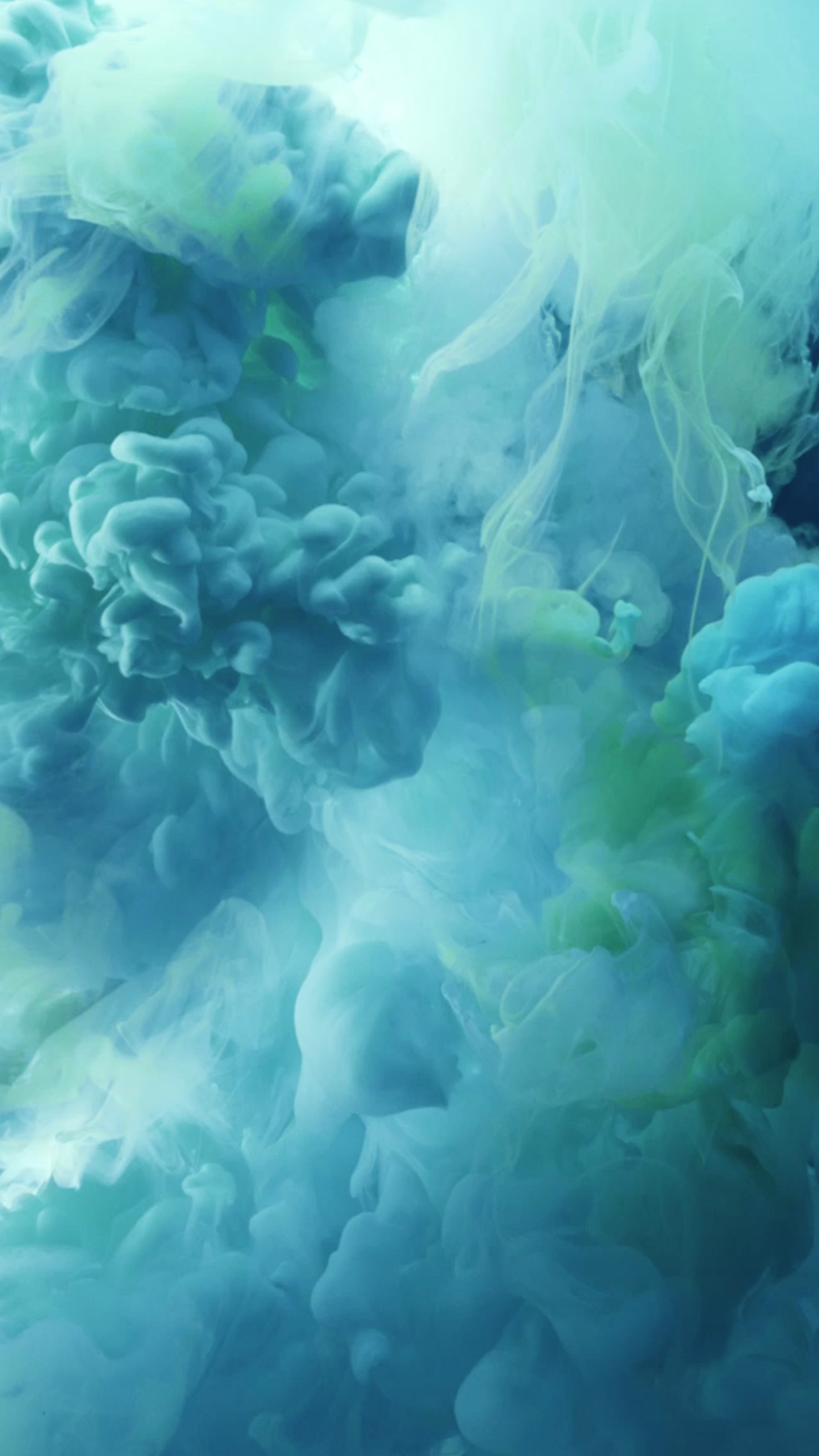 Abstract turquoise and green ink swirling in water, creating a dynamic and mesmerizing live wallpaper