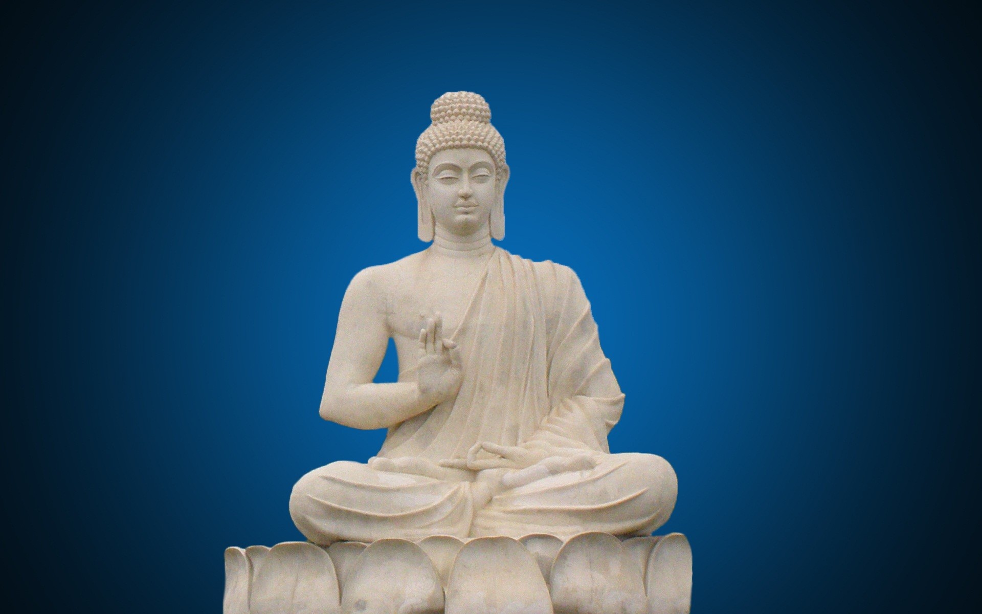 Serene Buddha Statue on Blue Background