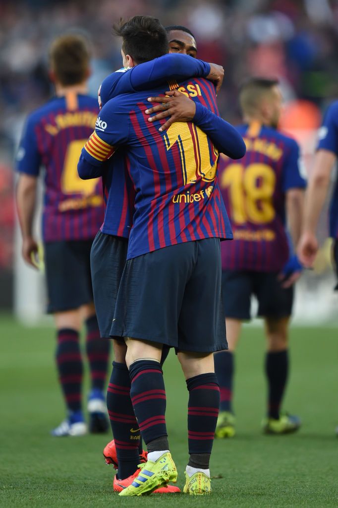 Lionel Messi Of Barcelona Celebrates With Teammate After