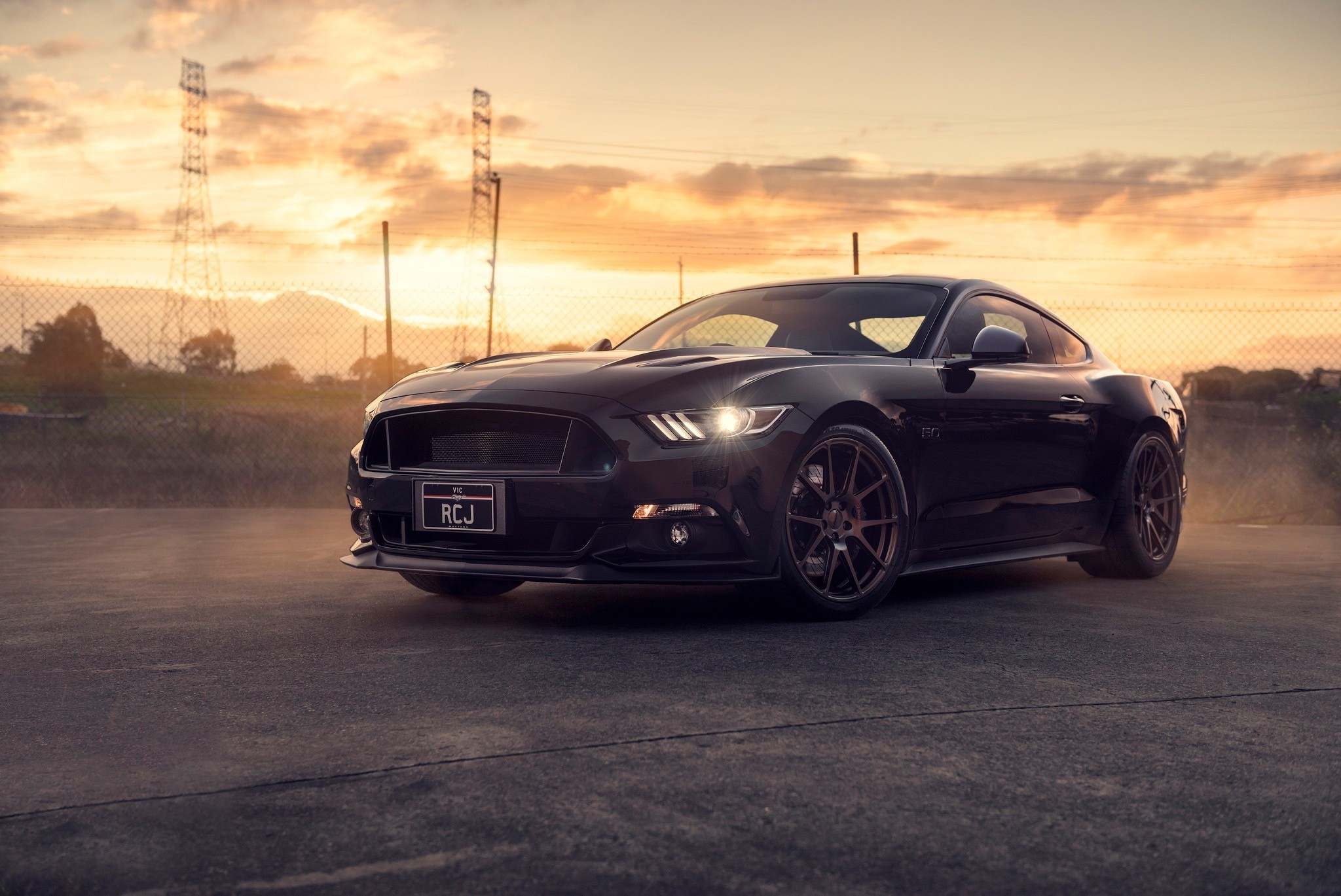 Black Ford Mustang GT Coupe parked on asphalt at sunset, HD Mustang Wallpaper