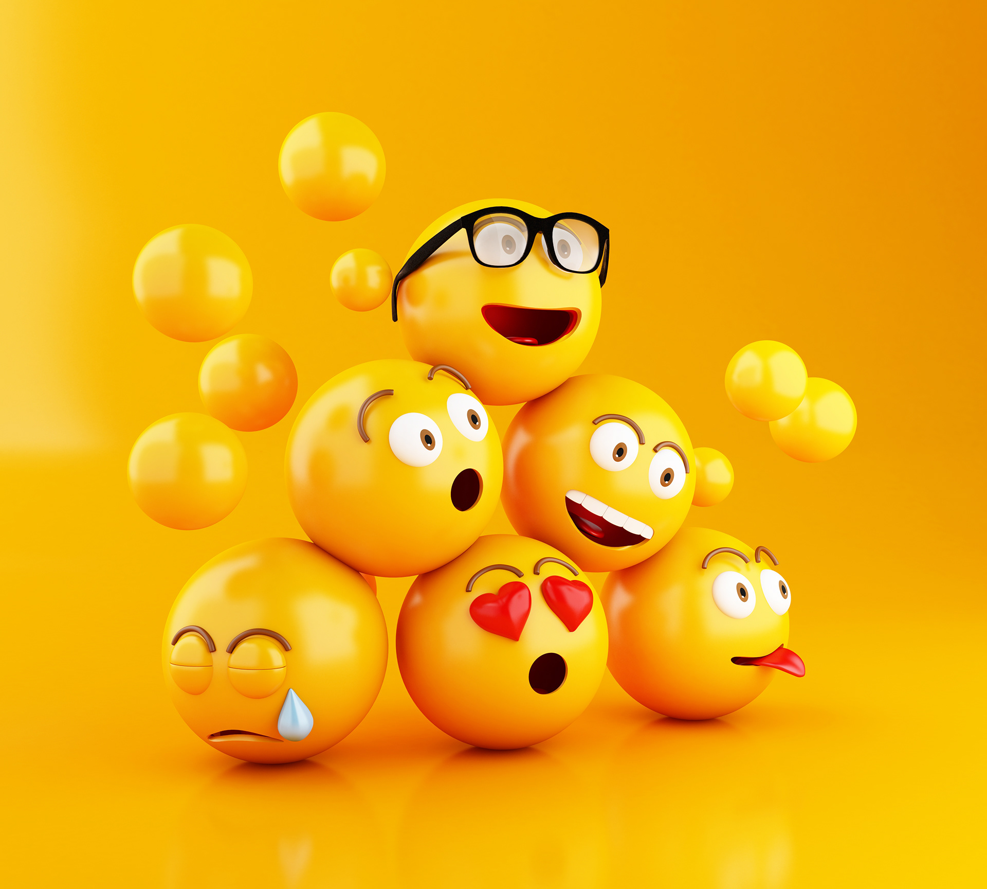 3D rendering of a variety of emojis with different expressions on a yellow background