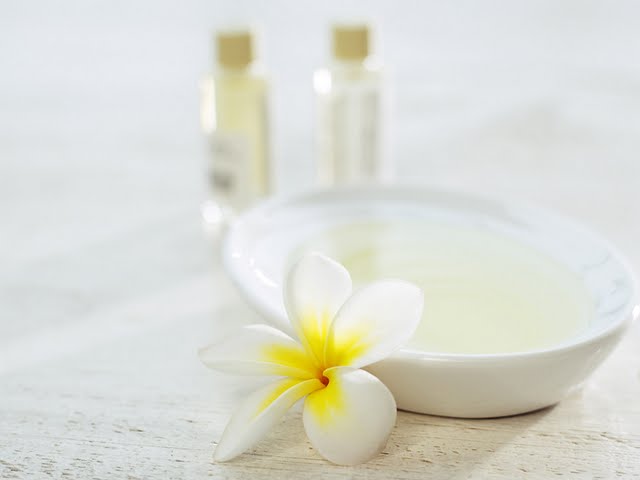 Spa Elements Bowl Of Essential Oil With Plumeria Blossom Wallpaper