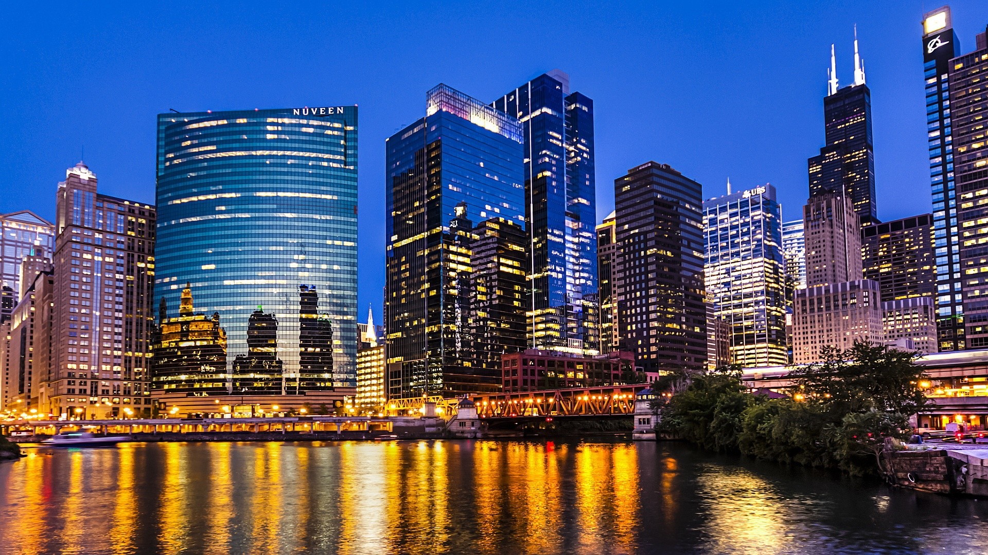 Stunning night view of the Chicago skyline reflected in the Chicago River