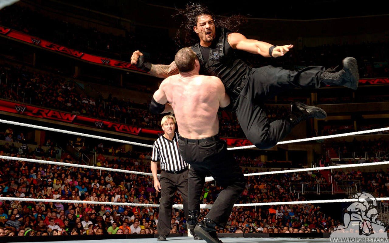 Roman Reigns Punching Kane